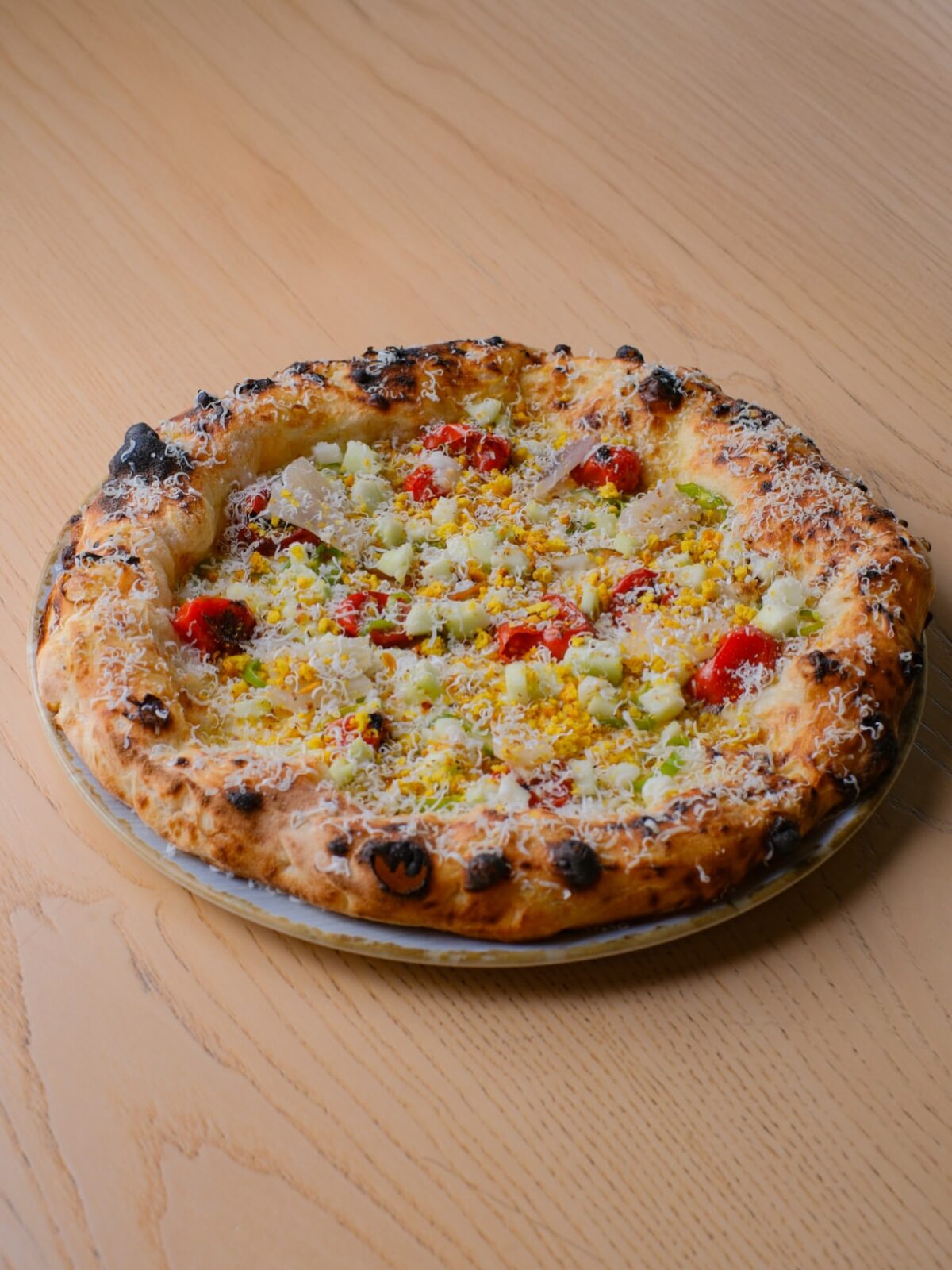 A pizza with a tall, airy crust