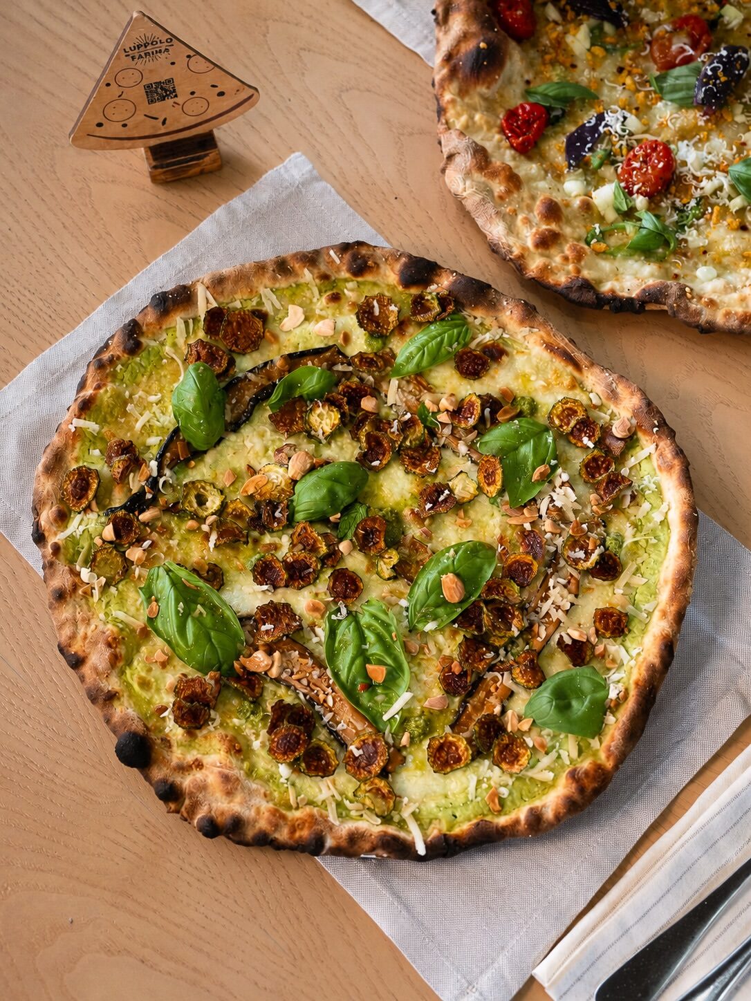 A thin, crisp pizza on the table