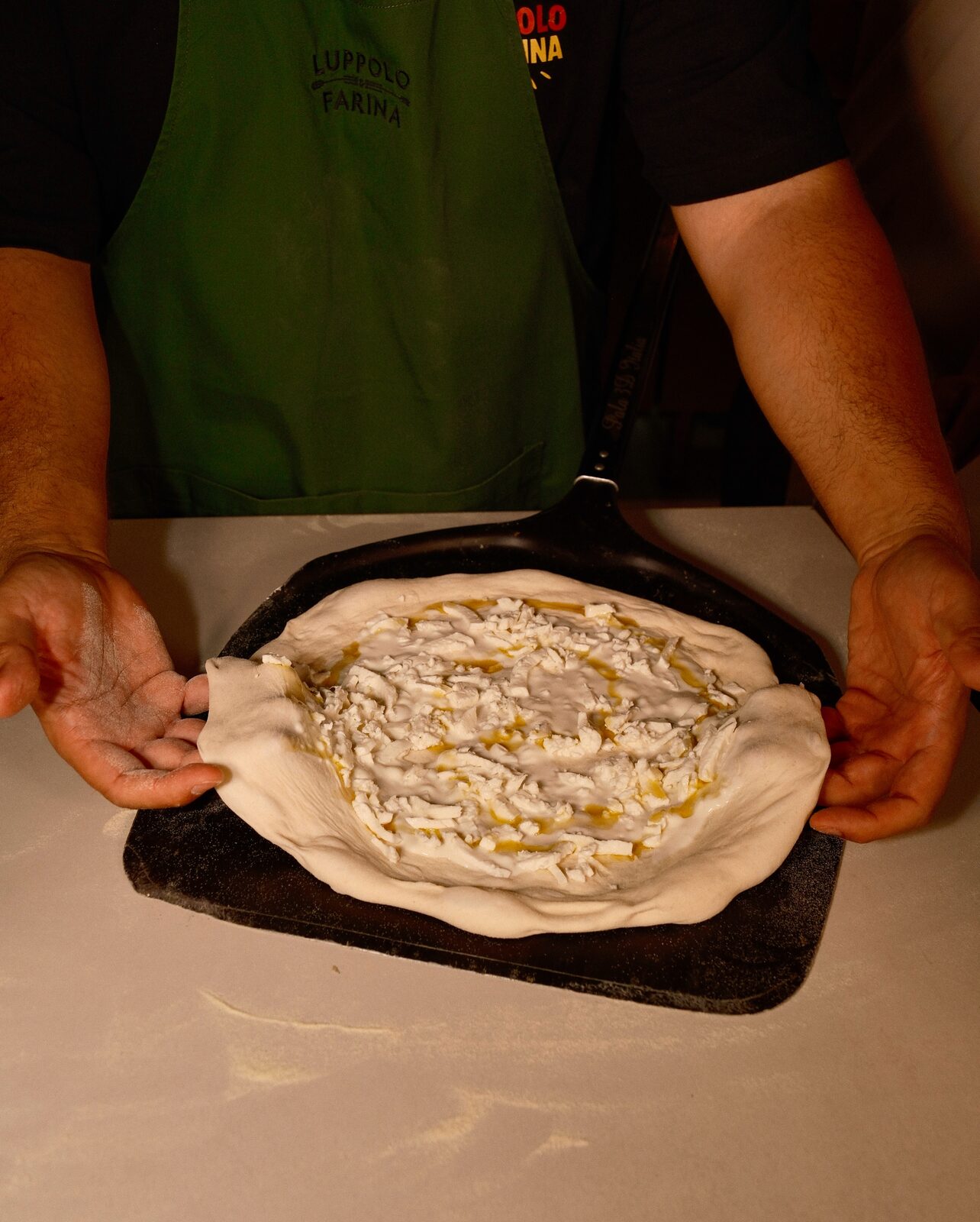 The pizzaiolo with the peel